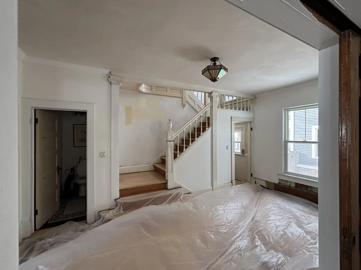 Entry and staircase, before