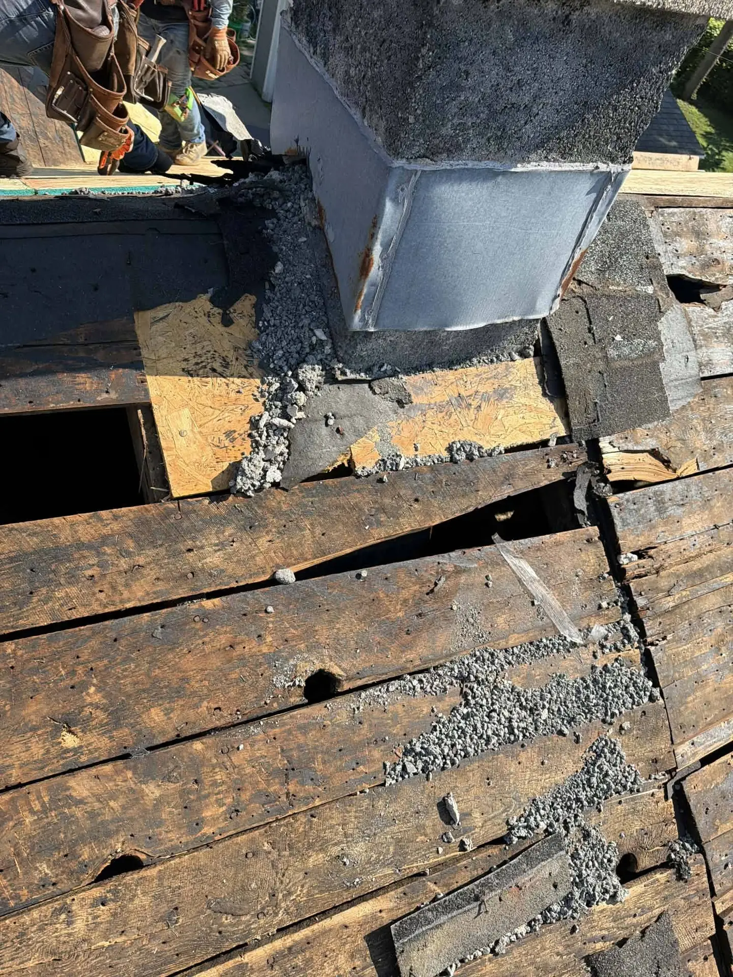 Rotted decking found around a chimney once the shingles came off. This is why decking cannot be quoted until we can see the wood.